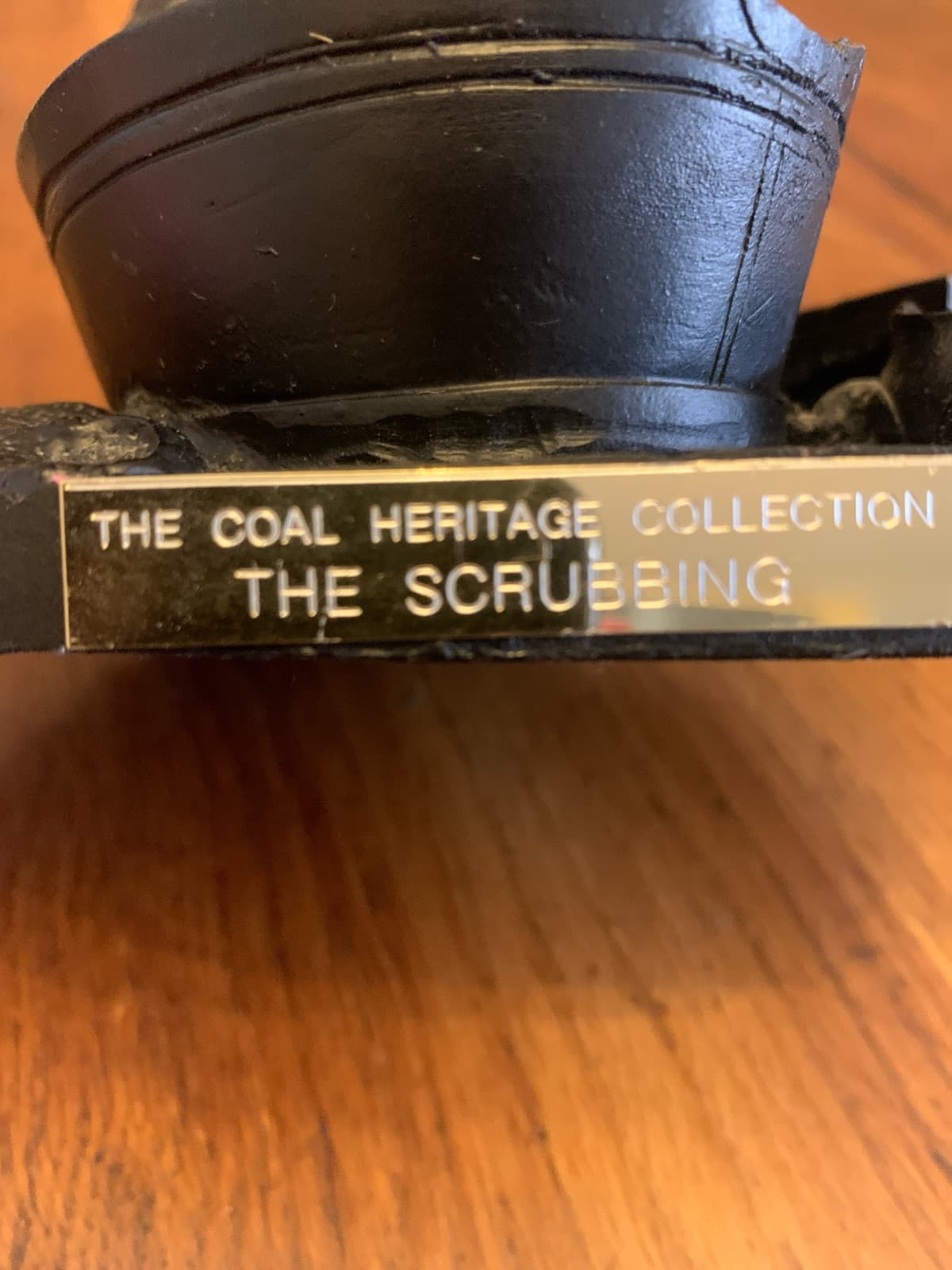 Vintage miniature coal sculpture titled “The Scrubbing” from the Coal Heritage Collection